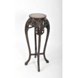 A late 19th / early 20th century Chinese carved hardwood jardinière stand
