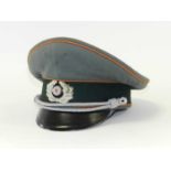 A reproduction German Third Reich Army Field Police Officer’s visor cap