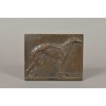 A bronze relief plaque of a borzoi dog on side profile