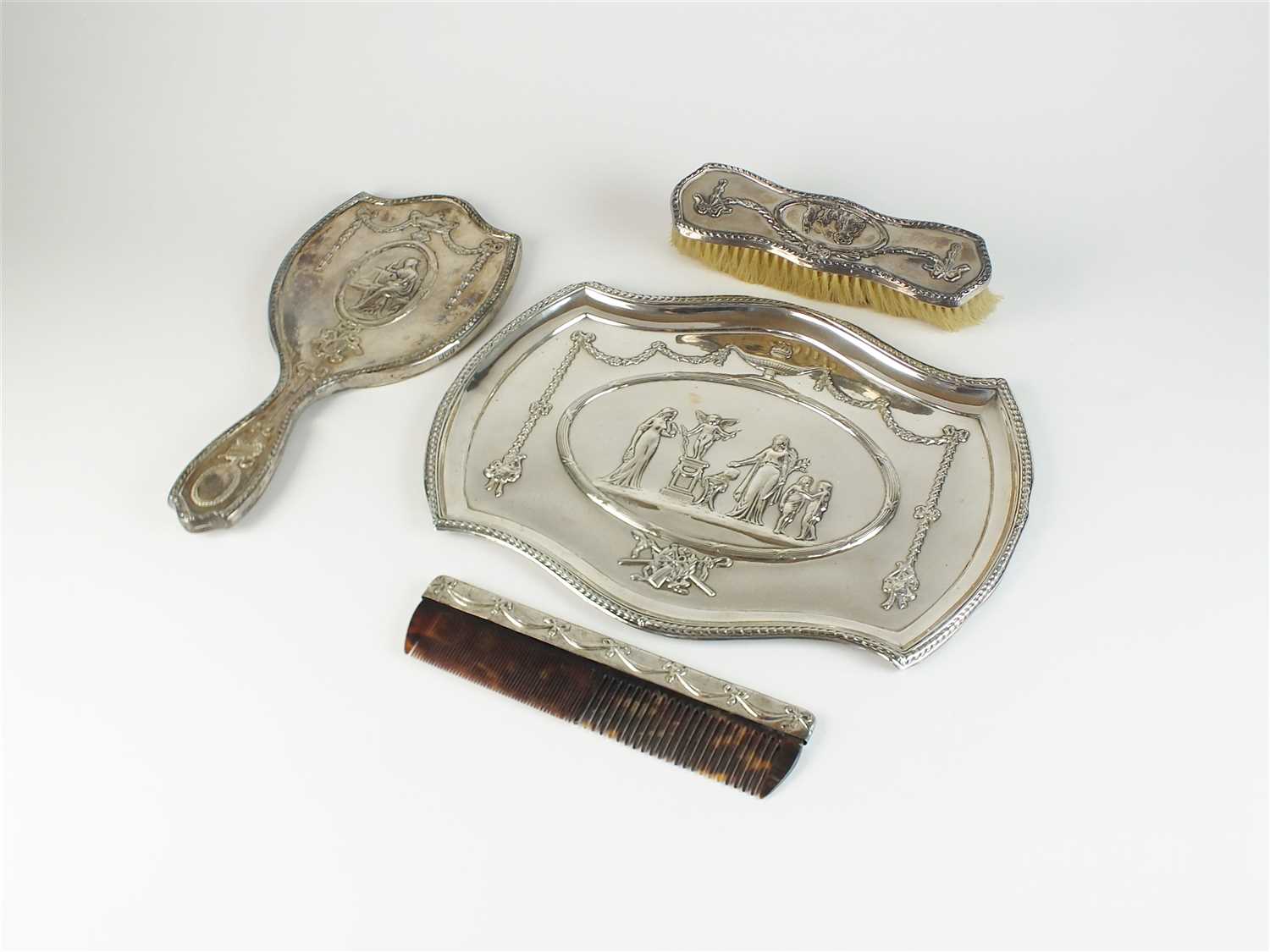 An Edwardian silver dressing table set