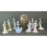 Eight Coalport models of ladies together with a Franklin Mint Fabergé egg clock