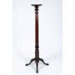 A tall 19th century mahogany torchere stand,