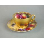 Royal Worcester fruit-decorated teacup and saucer