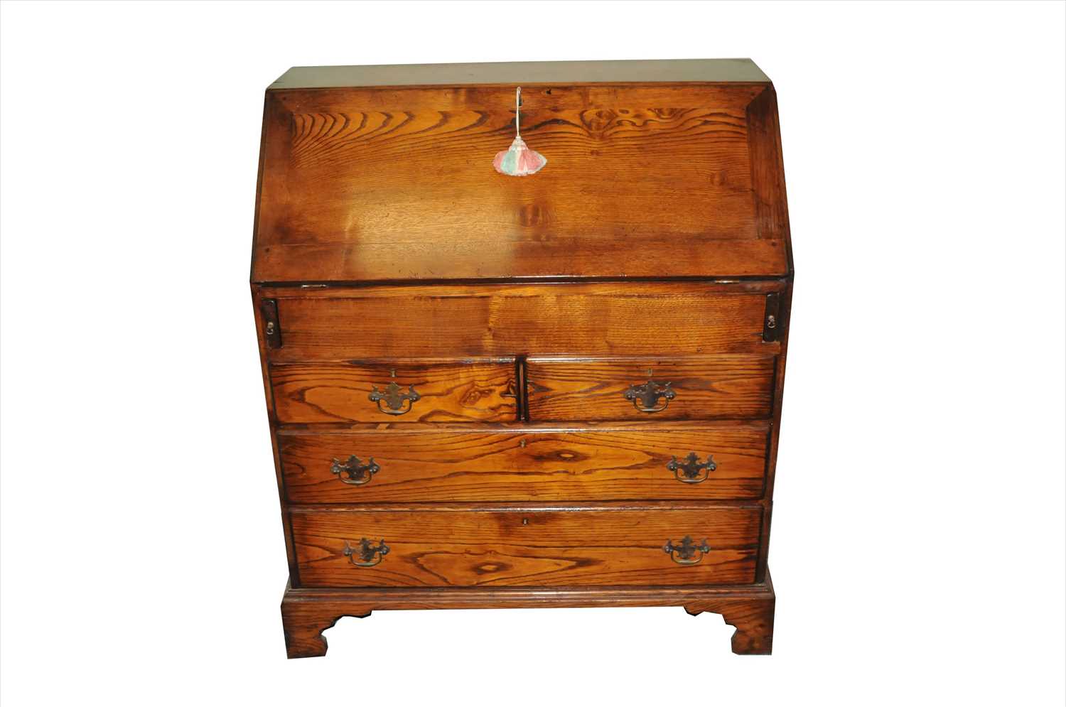 A good quality reproduction oak bureau in the George III style