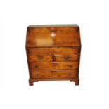 A good quality reproduction oak bureau in the George III style