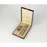 A commemorative Dunhill cased lighter, fountain pen and biro set