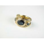 A three stone untested sapphire ring