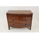 An oak topped mahogany veneered bow-fronted chest of drawers