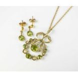 A peridot and seed pearl pendant