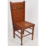 An Edwardian pale oak tailor's shop advertising chair