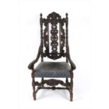 A 19th century Carolean style carved oak armchair
