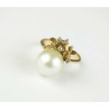 A cultured pearl and diamond ring