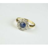 An early 20th century sapphire and diamond floral cluster ring