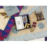 A suitcase containing a collection of Masonic Regalia