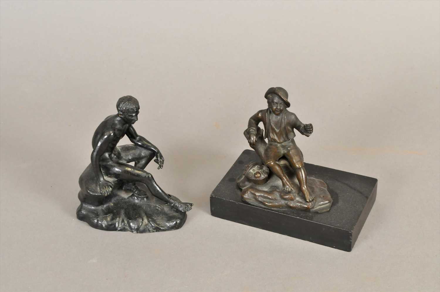 A small 19th century bronze study of the seated Hermes and a further small bronze figure