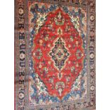 A red ground full pile Persian sarouk carpet