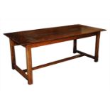 A reproduction rustic oak refectory table