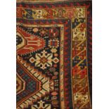 Karagashli rug, East Caucasus, the indigo field with a column of stepped medallions, enclosed by