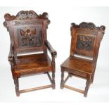 A large and impressive set of six (4+2) heavy 17th century style carved oak dining chairs, the backs