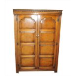 A good quality reproduction oak double wardrobe