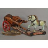 An early 20th century push-along horse, a wooden cart and scratch-built naval destroyer