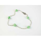 A jade and seed pearl set bracelet