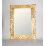 A 19th century gilt cut wood Florentine style framed wall mirror