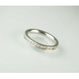 A platinum half hoop eternity ring