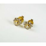 A pair of diamond cluster earrings