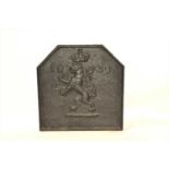 A 17th century or later cast iron fire back
