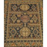 A Kuba rug, North-East Caucasus, the compartmentalised field with three octagons, enclosed by leaf