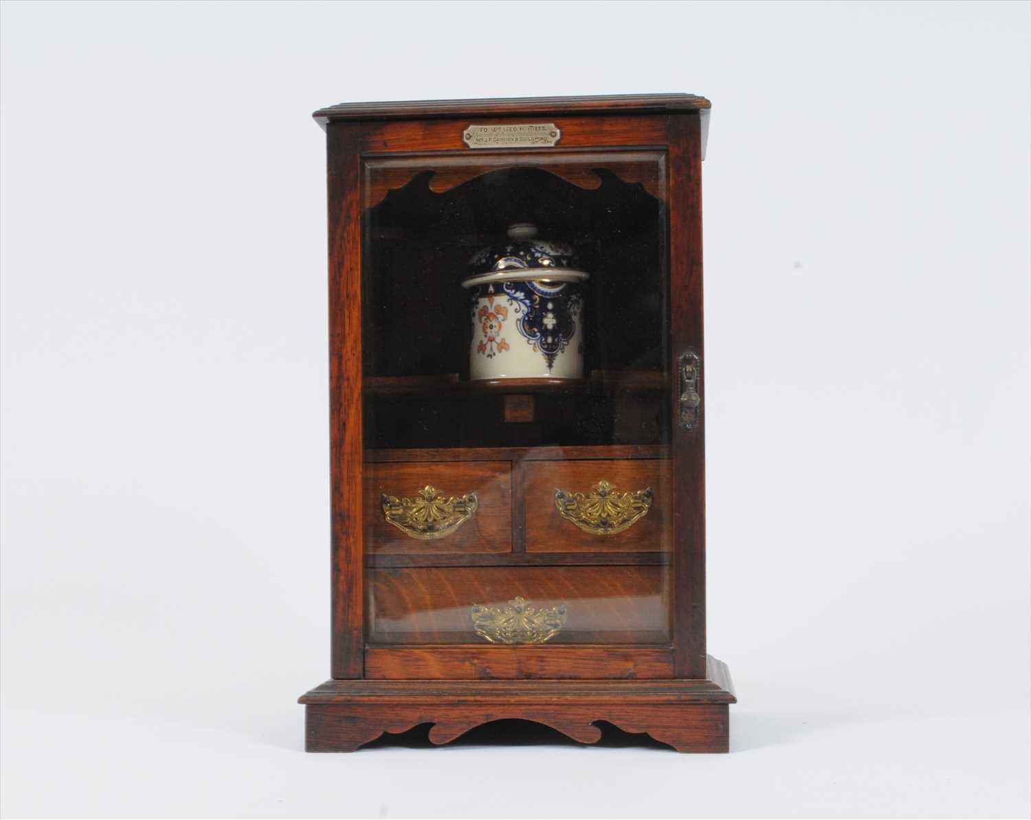 A late Victorian oak smoker's cabinet and a Mason's ironstone washing set