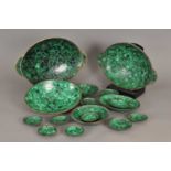 A large collection of various African malachite bowls