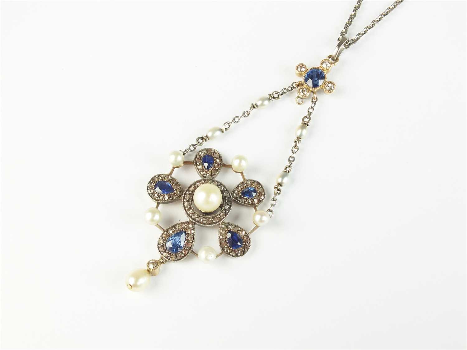 An early 20th century sapphire, pearl and diamond pendant