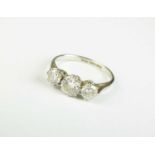 A graduated three stone diamond ring