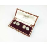A pair of mother of pearl and seed pearl cufflinks