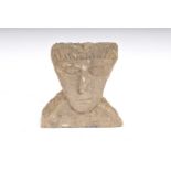A weathered carved limestone bust