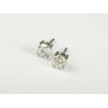 A pair of diamond stud earrings