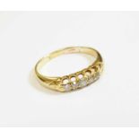 An 18ct gold five stone diamond ring