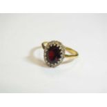 A garnet and diamond cluster ring