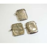 A collection of three silver vesta cases