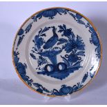 AN 18TH CENTURY DELFT BLUE AND WHITE POTTERY DISH, decorated with a bird in a landscape. 25.5 cm