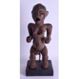 AN EARLY 20TH CENTURY AFRICAN POLYCHROMED TRIBAL FERTILITY FIGURE modelled with mouth open, with