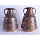 A PAIR OF 19TH CENTURY SILVER INLAID ISLAMIC MIDDLE EASTERN VASES decorated with motifs. 20 cm x