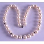 A WHITE GOLD DIAMOND AND PEARL NECKLACE. 40 cm long.