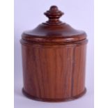 A TREEN CARVED WOOD TURNED CIRCULAR BOX AND COVER. 16 cm x 11 cm.