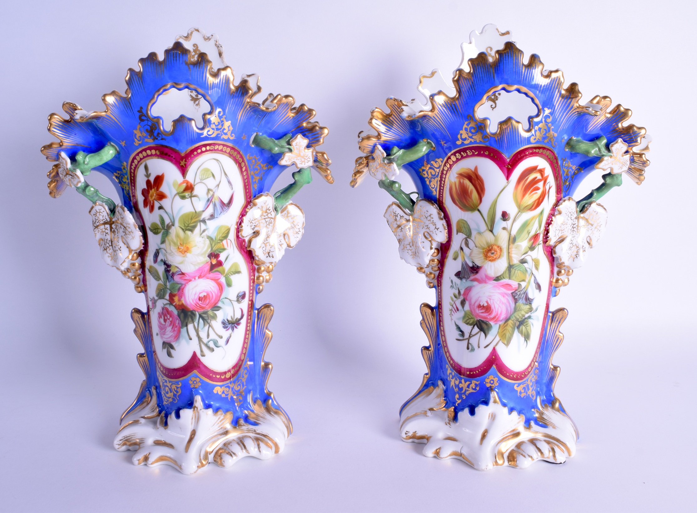 A LARGE PAIR OF 19TH CENTURY FRENCH TWIN HANDLED PORCELAIN VASES painted with floral sprays. 33 cm x