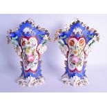 A LARGE PAIR OF 19TH CENTURY FRENCH TWIN HANDLED PORCELAIN VASES painted with floral sprays. 33 cm x