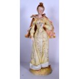 A LARGE BISQUE FIGURE OF A FEMALE, modelled standing wearing a cape, holding a rose. 53.5 cm