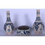 A DELFT POTTERY BOWL AND COVER, together with a pair of vases decorated with extensive foliage. Vase